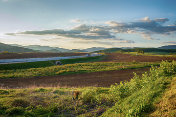 View of the highway in Lucenec region,southern Slovakia.Spring landscape.