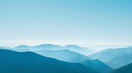 A blue sky over rolling hills.