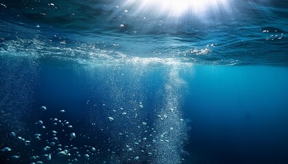 Underwater view with bubbles rising to the surface in a deep blue ocean. The image captures the serenity and mystery of the underwater world