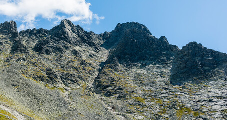 View from the valley to mountain peak Maly Lodowy Szczyt (Siroka veza) . Tatra Mountains, Slovakia.