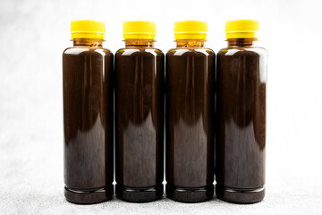 Transparent bottle of chocolate milk or cocoa milk in transparent bottle with yellow lid. Healthy chocolate and quite popular take a home