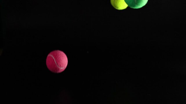 Colorful Tennis Balls in Motion