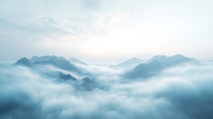 a wide shot of the top view of mountains covered in snow, clouds and blue sky