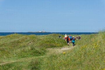 Senior hiking along Sele beach, Voll, Rogaland, Norway.