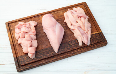 Fototapeta premium Raw chicken meat fillet ( breast ) Various of cutting in form slice and cube