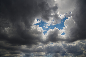 Letter W in the clouds, clouds formed a celestial crown, clouds created the letter W.