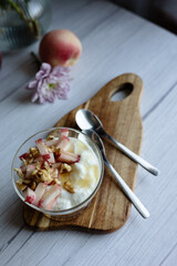 Greek yoghurt with peach and honey. Hight key. Place for text
