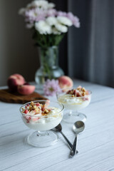 Greek yoghurt with peach and honey. Hight key. Place for text