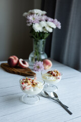 Greek yoghurt with peach and honey. Hight key. Place for text