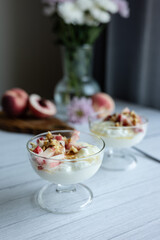 Greek yoghurt with peach and honey. Hight key. Place for text
