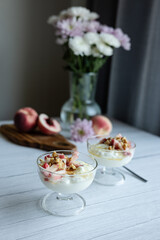 Greek yoghurt with peach and honey. Hight key. Place for text