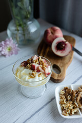 Greek yoghurt with peach and honey. Hight key. Place for text
