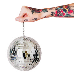 Tattooed hand holding Christmas glass ball transparent png