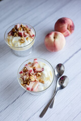 Greek yoghurt with peach and honey. Hight key. Place for text