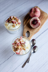 Greek yoghurt with peach and honey. Hight key. Place for text