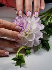 The beauty of the natural nails. Perfect clean manicure. New trendy nail arts on young women hand