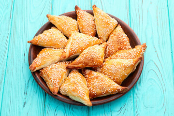 Homemade triangle puff pastry with meat on rustic background . Samosa