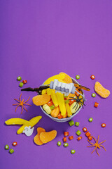 Traditional festive composition for Halloween party. Sweet seasonal food, homemade autumn decor