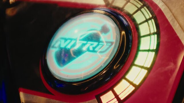Hand pressing nitro button dropping nitrogen explosive starting a war in arcade video games room