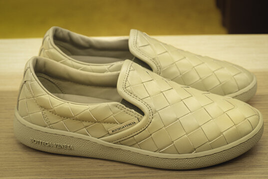 Loafers without laces with soft beige woven leather upper and Bottega Veneta logo on the sole.Milan - Italy,02 August 2024