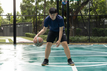 Man Stretching on Basketball Court Outdoors