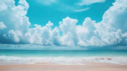 Beautiful beach scene with white clouds drifting across a bright blue sky. Tropical holiday vibes.