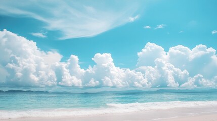 Fototapeta premium Beautiful beach scene with white clouds drifting across a bright blue sky. Tropical holiday vibes.