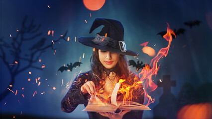 Halloween Witch girl with magic Book of spells portrait. Beautiful young woman in witches hat...