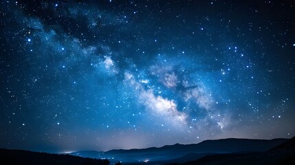 Dark night sky with bright stars and a hint of nebula in the vast space