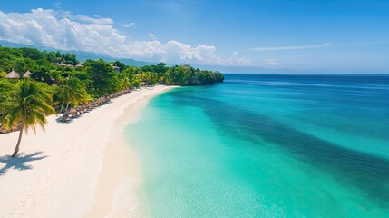 Turquoise waters and white sandy beach lined with palms in Jamaica. Perfect tropical getaway.