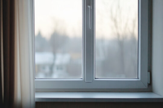 Fototapeta Calm morning light through a window with outdoor view