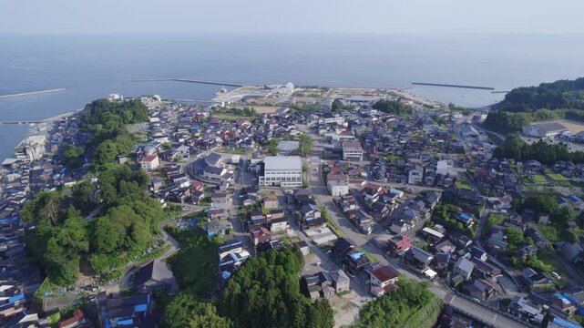 Buildings in Ushitsu are still covered by blue sheets 6 months after the 2024 Noto earthquake.