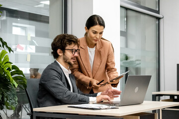  Employees participating in a brainstorming session in an office conference room. A perfect shot to illustrate a dynamic and creative work environment