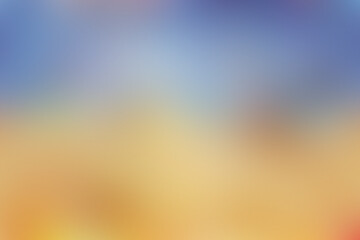 Naklejka premium The sky transitions through vibrant colors as the sun sets over the tranquil ocean, illuminating the sandy beach with warm hues