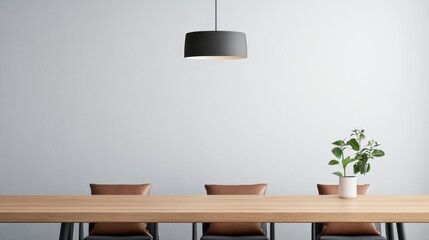 Contemporary dining area with a sleek wooden table, leather pillows on minimalist chairs, and a statement pendant light above