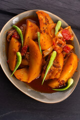 fried potatoes with paprika sauce. crispy fried patata bravas, fried potatoes with smoked paprika sauce