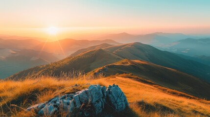 A hopeful sunrise graces this scene of rolling hills and bright grassy terrain, casting warm light over the landscape and signaling the promise of a new day.