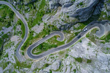 Fototapeta premium Overhead View Of Vehicles Driving On Serpentine Highway In Cheile Bicazului, North-eastern Romania. Aerial Shot. Beautiful simple AI generated image in 4K, unique.