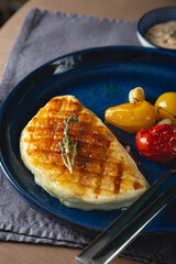 Fried halloumi cheese with baked tomatoes