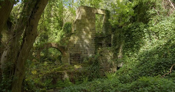 wide shot of the remains upper bleaching mill at Lumsdale waterfalls, Matlock