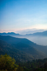 Smoky Sunset View from the Top of a Mountain