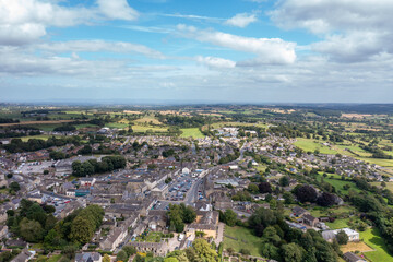Obraz premium Aerial drone photo of the beautiful town of Leyburn which is a market town and civil parish in North Yorkshire in the UK, showing the houses in the town from above in the summer time
