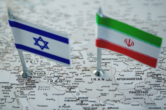 Israel and Iran national flags on geopolitical middle east map