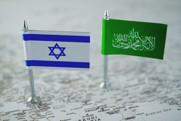 Israel and hamas flags on geopolitical middle east map