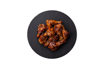 Delicious crispy baked chicken wings in teriyaki sauce