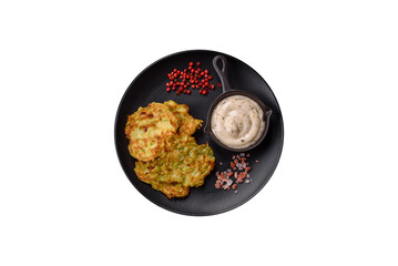 Vegetable zucchini fritters with garlic, salt, spices and herbs