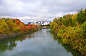 Bridge in autumn over the river. Quebec, Canada