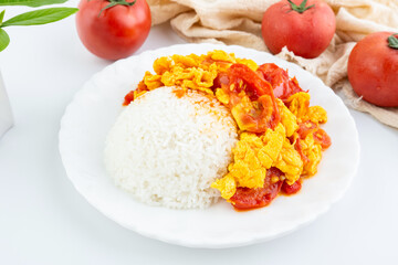 A dish of home-cooked tomato scrambled eggs with rice