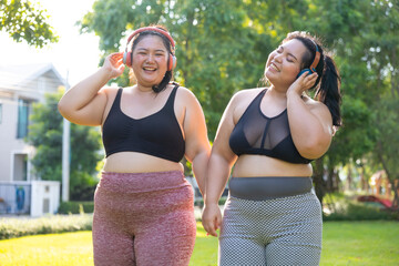 Dance, Listening music headphone. beautiful young chubby overweight woman in sportswear doing...