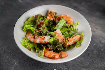 shrimp salad prawns or langoustines green leaf lettuce mix fresh meal food snack on the table copy space food background rustic top view